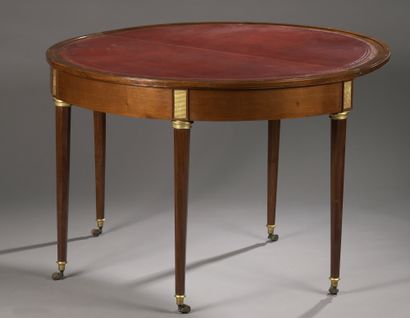 null Mahogany and blond mahogany veneer half moon table. Folding top, upholstered...