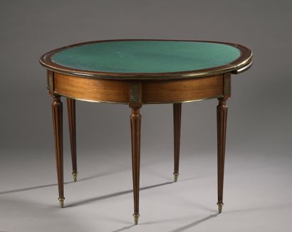 null Mahogany and mahogany veneer half-moon game table. Three folding trays, one...