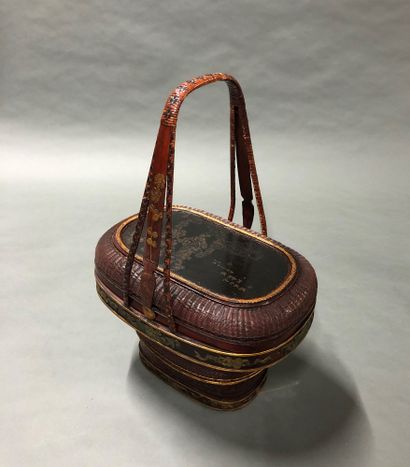 Covered woven basket in exotic wood decorated...