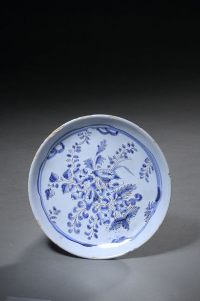 null Earthenware dish decorated with chatironnées flowers in blue and manganese on...