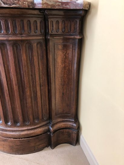 null Molded oak cove with fluting motifs in the front. Marble top. 


Stamped " P....