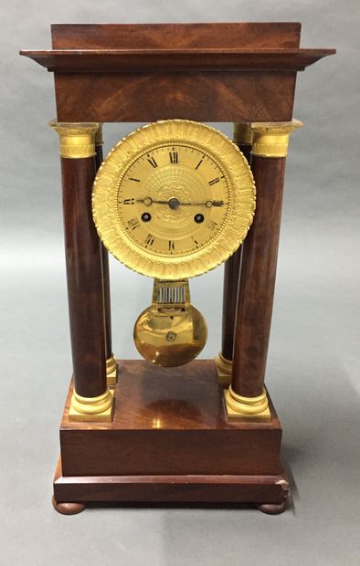  A mahogany and mahogany veneer portico clock with a guilloche brass frame. 
19th...