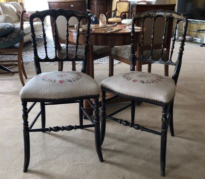 null Pair of blackened wood chairs.


A chair upholstered in red velvet is attached....