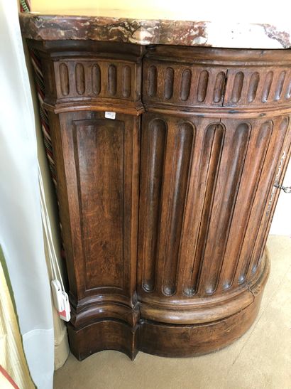 null Molded oak cove with fluting motifs in the front. Marble top. 


Stamped " P....