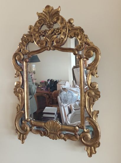 Gilded wood mirror with a pediment and openwork...