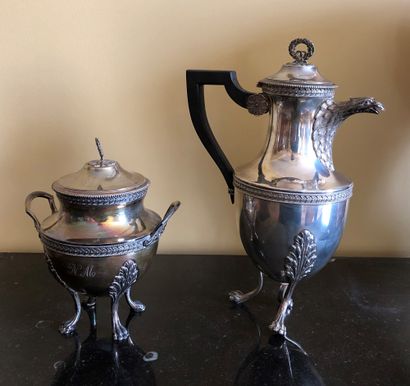 null Part of a silver tea service including : 


- Tripod teapot decorated with an...