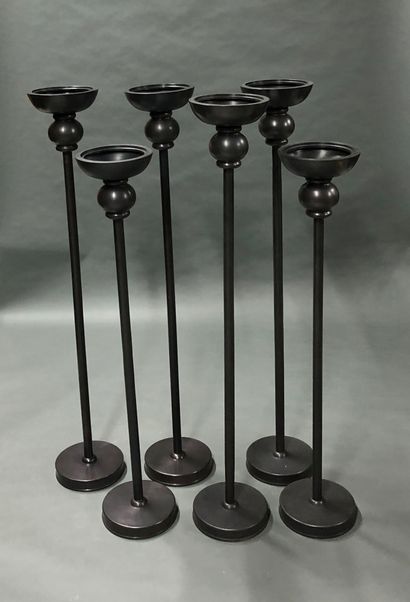 Set of six metal candle holders. 
H. 87 cm...