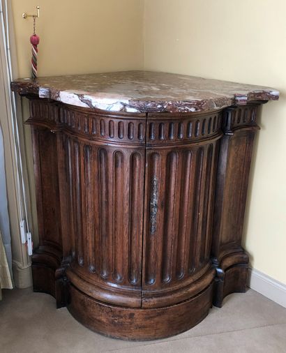 null Molded oak cove with fluting motifs in the front. Marble top. 


Stamped " P....