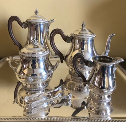 null A silver tea-coffee set including : 


- A teapot


- A coffee pot 


- A sugar...