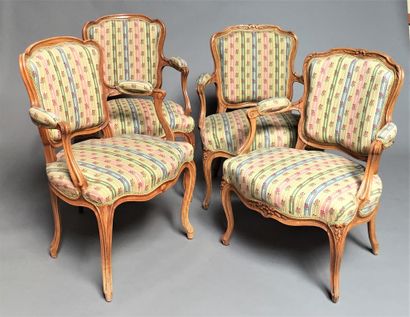  Two pairs of armchairs in moulded wood. One carved with flowers. 
Curved legs. 
Louis...