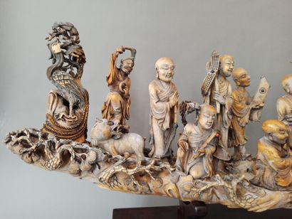 null Ivory group depicting the eighteen luohans (arhats), accompanied by a chimera,...
