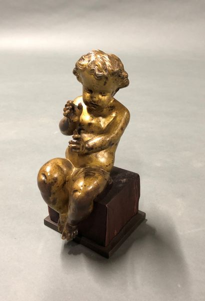  Bronze with golden patina showing a seated...