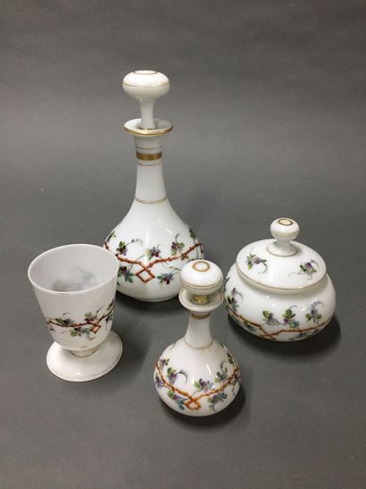 null Opaline lot including two covered carafes, a covered sugar bowl and a glass...