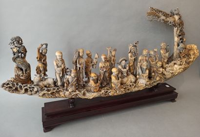 null Ivory group depicting the eighteen luohans (arhats), accompanied by a chimera,...