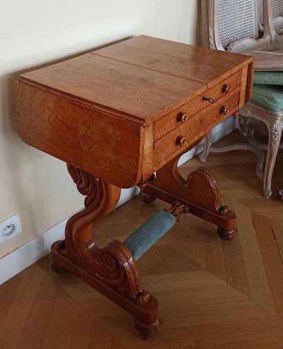 Maple veneer book table with shutters. It opens to two drawers. Sinuous legs on...