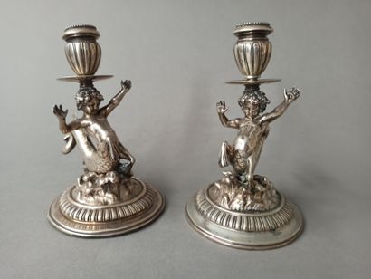 Pair of small silver candlesticks decorated...
