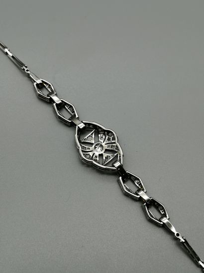 null 18K white gold 750‰ bracelet, composed of pierced geometric elements set with...