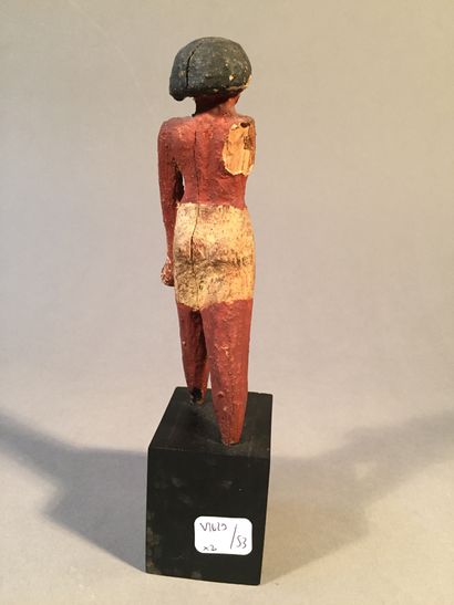 null Lot composed of an Egyptian style polychrome stuccoed wood figure, an Egyptian...