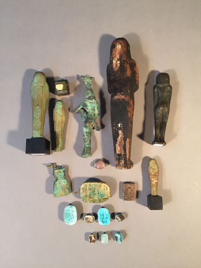 null Lot composed of an Egyptian style polychrome stuccoed wood figure, an Egyptian...