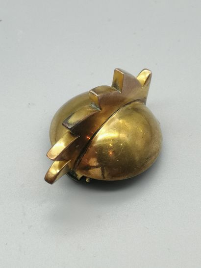  HERMÈS 
Gold-plated metal lapel clip, consisting of a half-sphere adorned with a...
