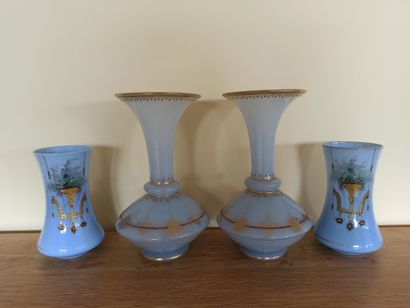 null Two pairs of blue opaline glass vases with enamelled and gilded decoration.


H:...