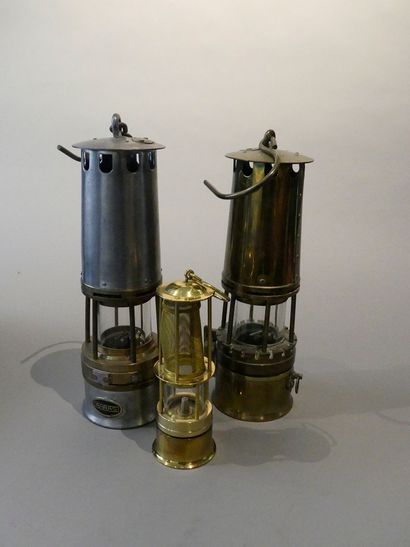 null Two miner's lamps in brass and Baccarat glass. 


A modern miner's lamp is ...
