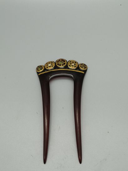 null Set of two tortoiseshell combs decorated with gold discs and studded with white...