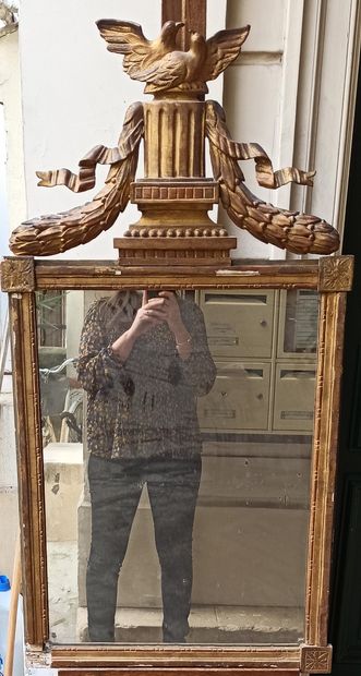 A pediment mirror in a gilded wood frame...
