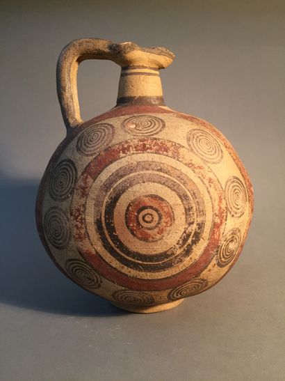 null Oenochoe with a spherical body decorated with a geometric pattern of concentric...
