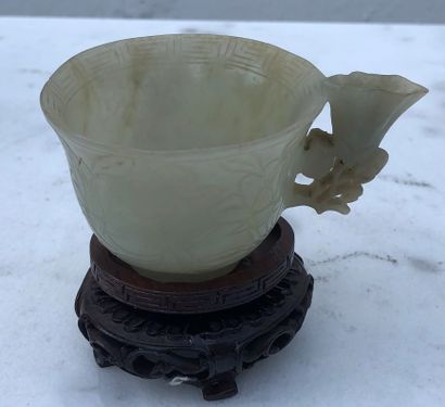 null Celadon jade cup with handle, engraved with flowers and foliage. China. Small...