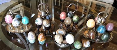 null Silver plated lot including four egg cup display stands and their spoons.

A...