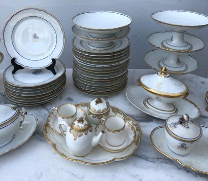 null Lot including: 

- A white porcelain cabaret tea set with gold rocaille style...