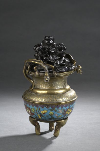 null A copper alloy and cloisonné enamel tripod candle jar, the feet in the form...
