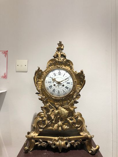 null Raingo Frères clock in Paris in gilt bronze and chased with rocaille decoration,...