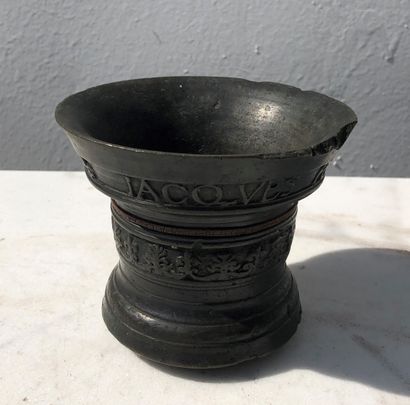 null Bronze mortar of truncated cone shape, the body decorated with mouldings, friezes...