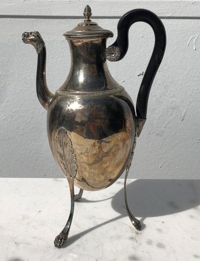 null Silver tripod teapot, blackened wood handle, claw feet. 19th century.

Wear...
