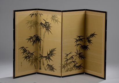 null A four-leaf folding screen with painted bamboo on a gilded background. Signed...