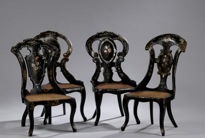 null FOUR LOW CHAIRS in blackened wood and papier maché with floral decoration inlaid...