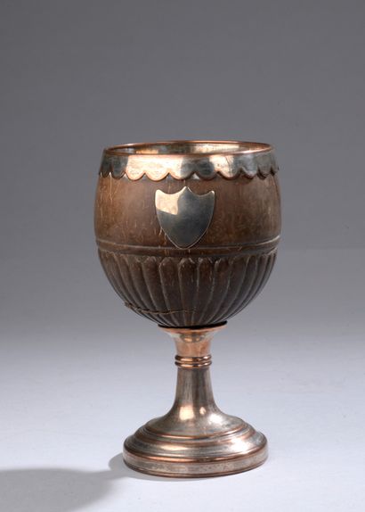 null Coconut cup with silver plated copper frame, 19th century work.

Slivering and...