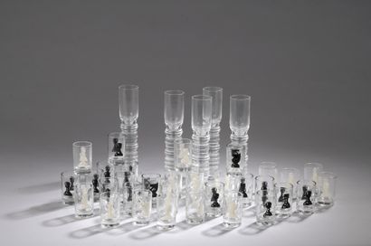 null SET OF THIRTY-TWO GLASSES showing the black and white pieces of a chess game....