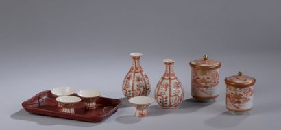 null Porcelain SAKE SERVICE including two pourers and four glasses. Small chips.

A...