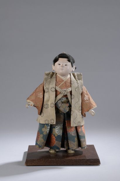 null DOLL in fabric and wood painted in the natural representing a man in traditional...