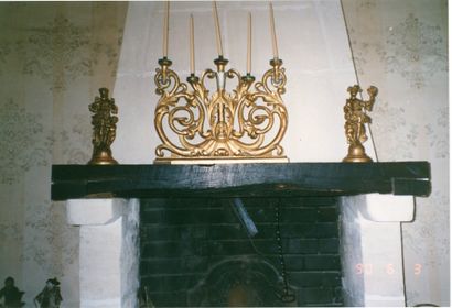 null A five-light wooden candelabra with a gilded and silvered front carved with...