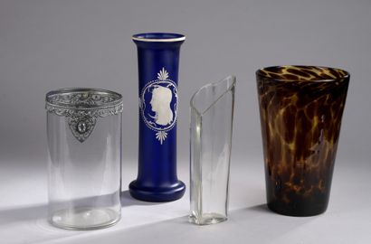 null LOT of four vases : 

- Blue glass vase with white enamelled decoration of a...