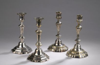 null TWO PAIRS OF FLAMPS in silver plated metal.

Louis XIV style 

H. 24 cm and...