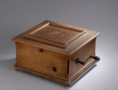null SYMPHONION in an oak and fruitwood case, top with floral inlaid decoration....