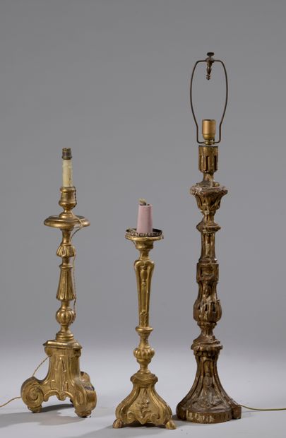 null LOT OF THREE carved and gilded wood PIQUE-CIERGES.

Italian work. The biggest...
