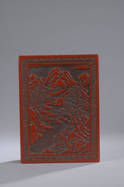 null Cinnabar lacquer box decorated with a landscape of mounts with a pagoda.

One...