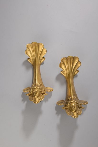 null Pair of gilded bronze paddles decorated with a woman's face in the antique ...