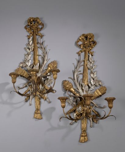 null Pair of giltwood and silver-plated three-arm sconces decorated with quivers,...